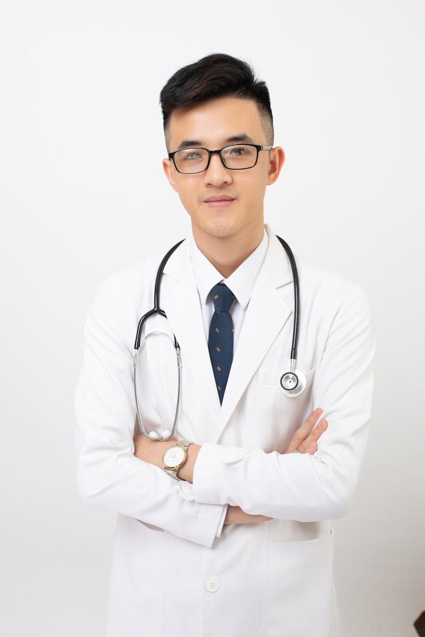 Portrait of a male optometrist in a white coat